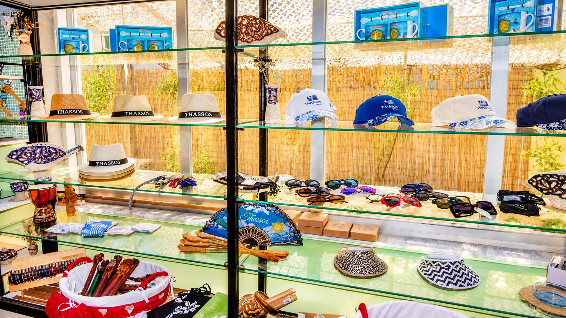 Gift shop display with Thassos hats, caps, sunglasses and souvenirs
